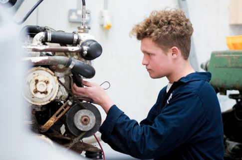 Marine student working on engine